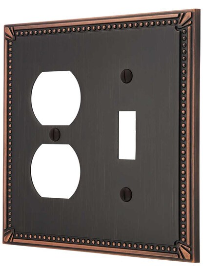 Imperial Bead Toggle/Duplex Combination Switch Plate in Aged Bronze.